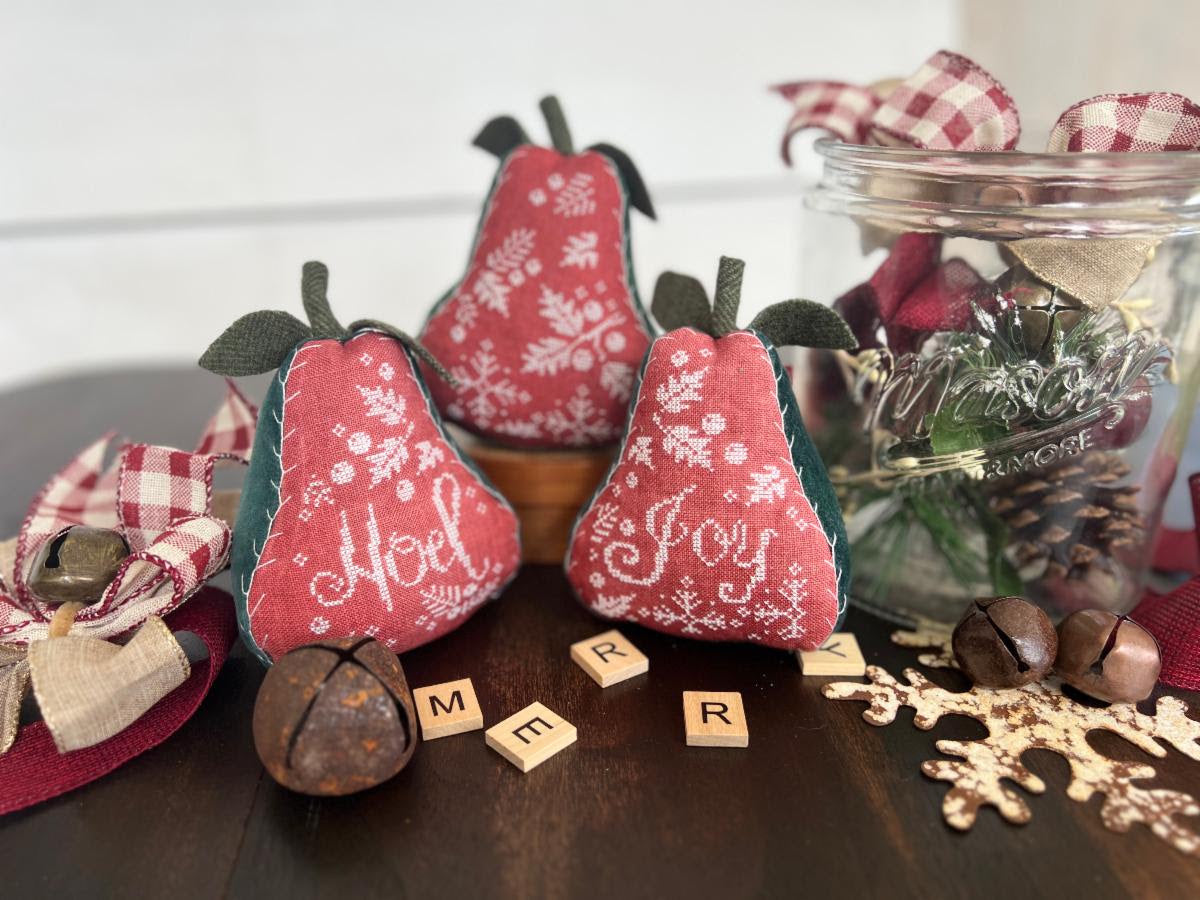 Christmas Pears by Annie Beez Folk Art: three red fabric pears with cream foliage stitching, Noel and Joy lettering, and green leaves.