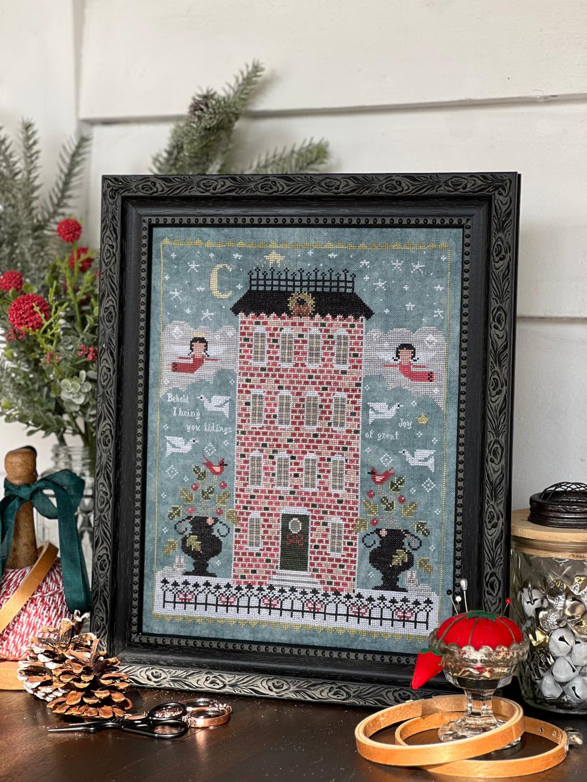 O Holy Night by Annie Beez Folk Art: framed Christmas sampler with a red brick house, angels, doves, cardinals, and a starry sky.
