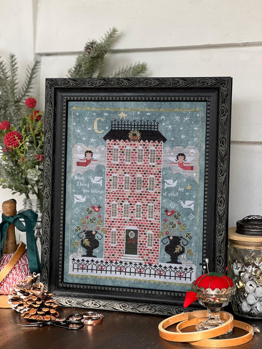 O Holy Night by Annie Beez Folk Art: framed Christmas sampler with a red brick house, angels, doves, cardinals, and a starry sky.