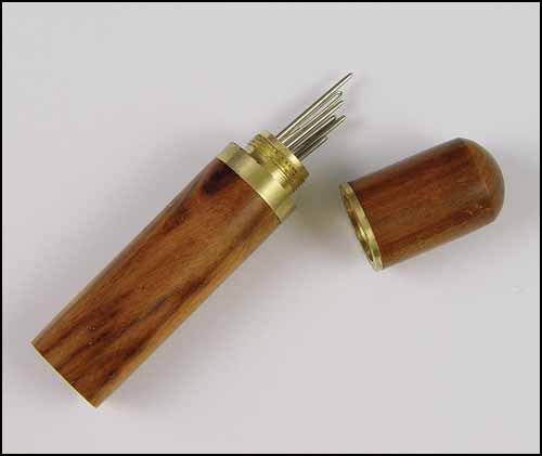 Medium brown wood needle case with brass closure